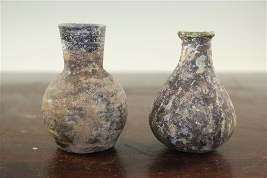 Two Syrian glass gourd flasks, c.6th century A.D., 8.5cm